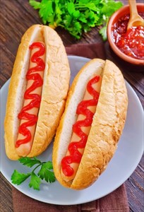 Processed foods - hot dogs on a plate.