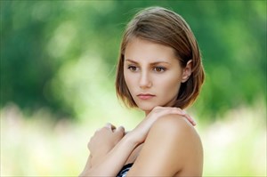 Young woman in despair about her lupus condition.