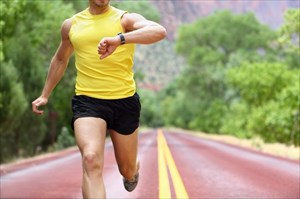 Young man running outdoors.
