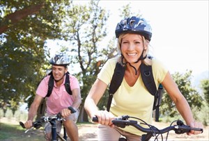 Happy couple cycling together.
