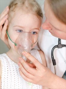 Little girl being treated after an asthma attack