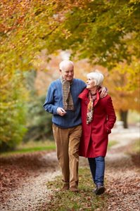 Senior couple walking along a path