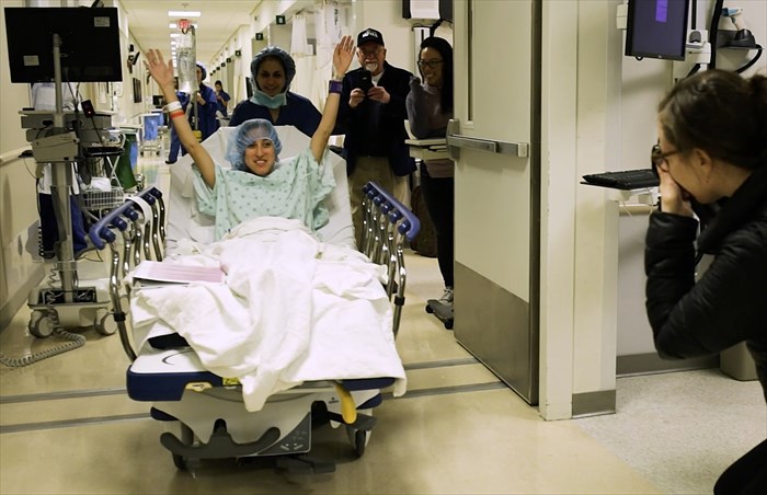 Nina Martinez being wheeled into surgery