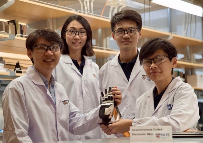 NUS researchers with Asynchronous Coded Electronic Skin (ACES) prototype