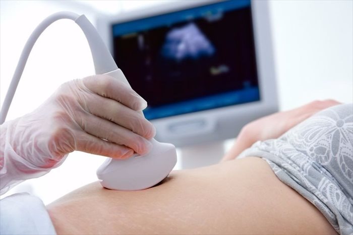 Young woman having an ultrasound scan