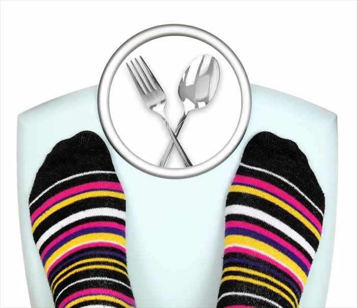 Feet on a scale (weight loss)