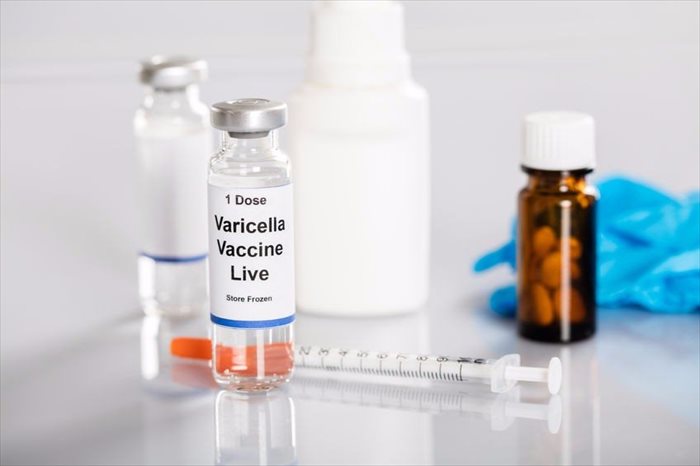 Varicella vaccine in vial with syringe and medicines