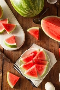 Ripe seedless watermelon cut into wedges.