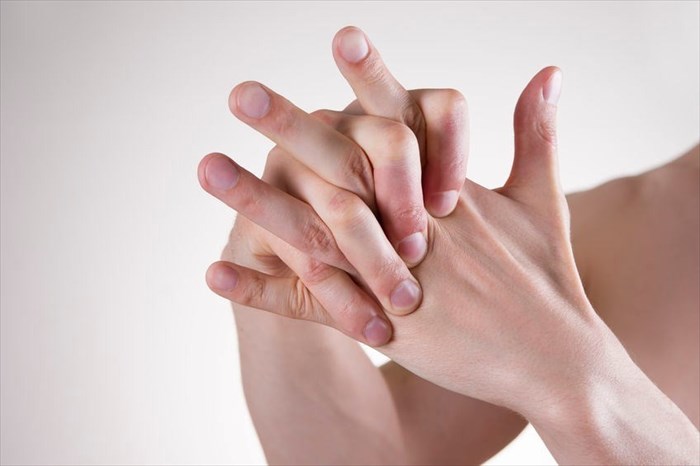 Cracking knuckles causing pain and swelling (or injury) in he finger joints.