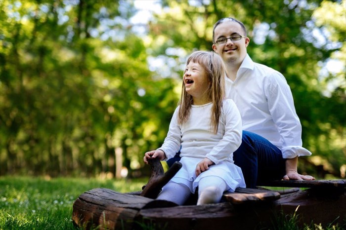 A father and daughter with down syndrome enjoying the outdoors.